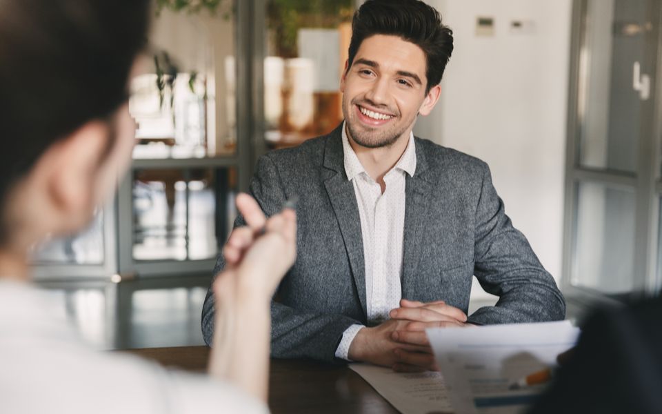 A smiling candidate in a job interview